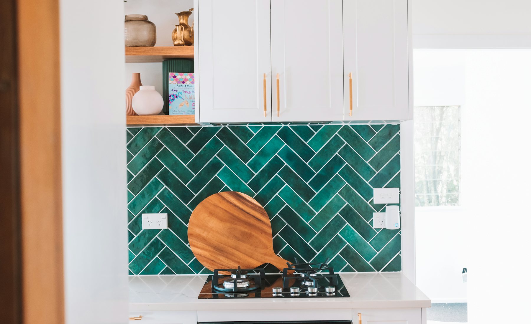 Green herringbone backsplash